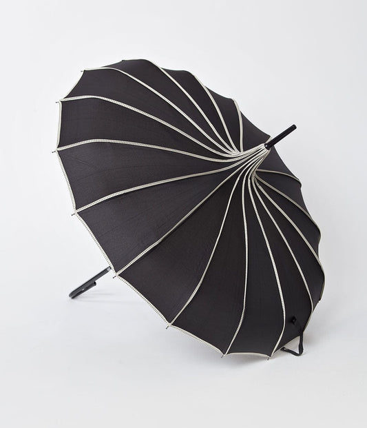 https://www.unique-vintage.com/cdn/shop/products/unique-vintage-black-polka-dot-tan-princess-pagoda-umbrella-939790.jpg?v=1703098619&width=533